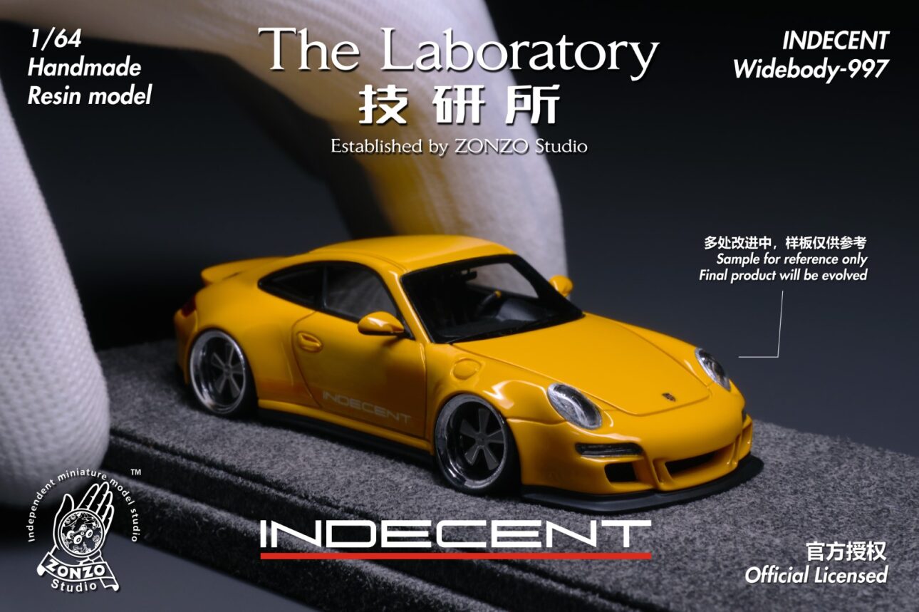 Yellow model car with branding and text on a dark background