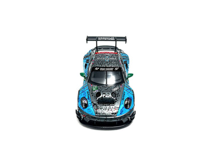 JICAR 1:64 911 GT3 R #97 Blue & Black Music Note Livery diecast model featuring musical note graphics across the hood and roof, green side mirrors, detailed headlights and large rear wing, top front view.