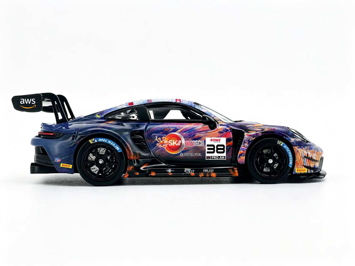 JICAR 1:64 GT3 Racing Car #32 The Scream Art Livery diecast model featuring purple, blue and orange abstract graphics, black racing wheels, detailed racing decals and large rear wing, side profile view.