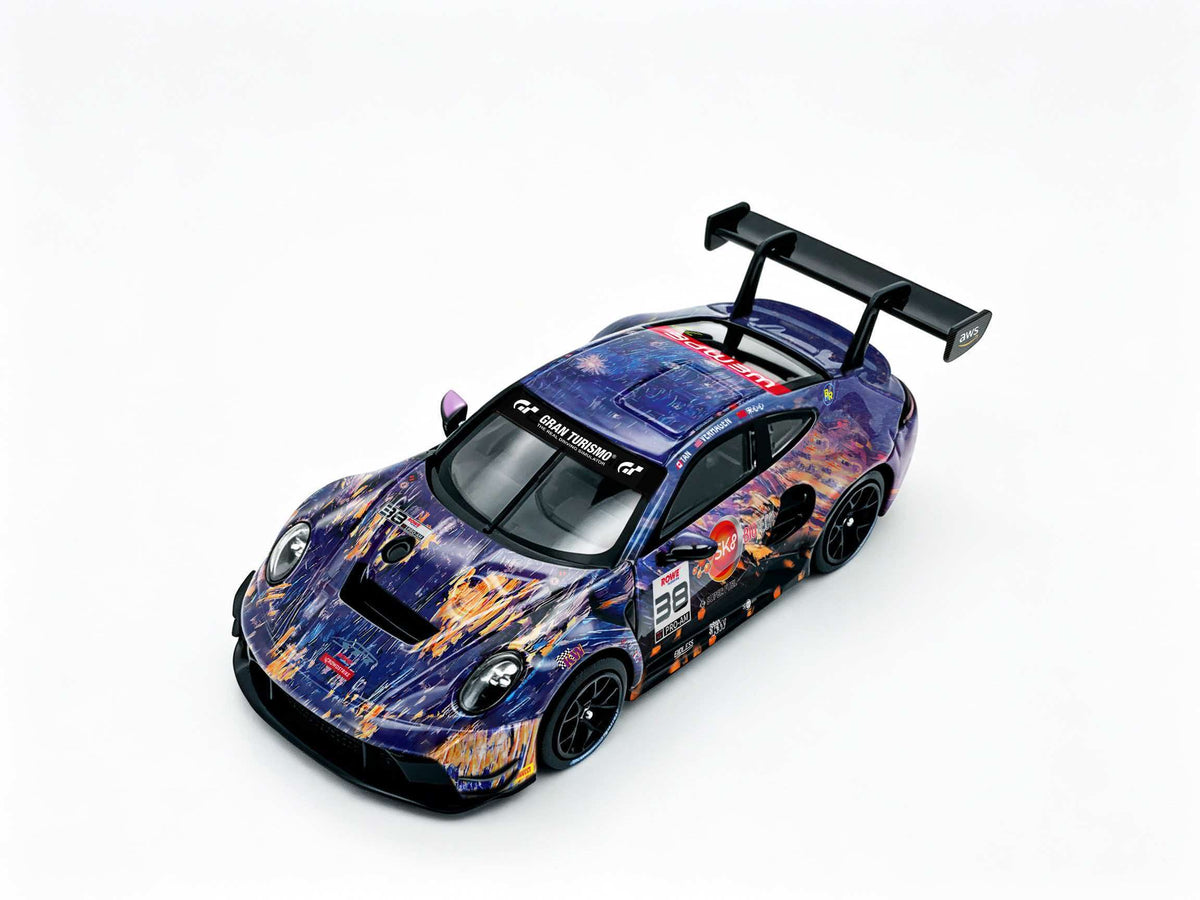 JICAR 1:64 GT3 Racing Car #32 The Scream Art Livery diecast model featuring purple and orange abstract artistic graphics, black racing wheels, detailed racing decals and large rear wing, elevated front three-quarter view.