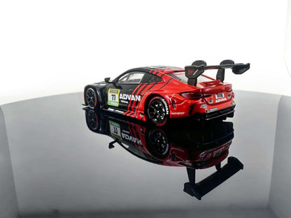 JICAR 1:64 M4 GT3 EVO #77 Black & Red Racing Livery diecast model featuring ADVAN-style graphics, black racing wheels, large rear wing, detailed rear diffuser and racing decals, rear three-quarter view.