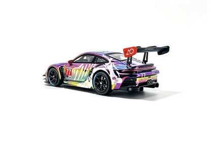 JICAR 1:64 Porsche 911 GT3 R #77 Iridescent Rainbow Chrome Tyrannosaurus Skeleton Livery Diecast Model Car Rear Three Quarter View Featuring Holographic Dinosaur Skeleton Graphics, Black Racing Wheels, Large Rear Wing and Rear Diffuser.