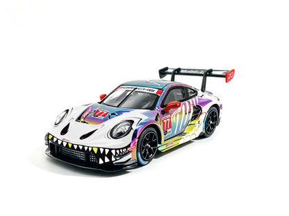 JICAR 1:64 Porsche 911 GT3 R #77 Iridescent Rainbow Chrome Tyrannosaurus Skeleton Livery Diecast Model Car Front Three Quarter View with Dinosaur Teeth Graphics, Black Racing Wheels and Large Rear Wing