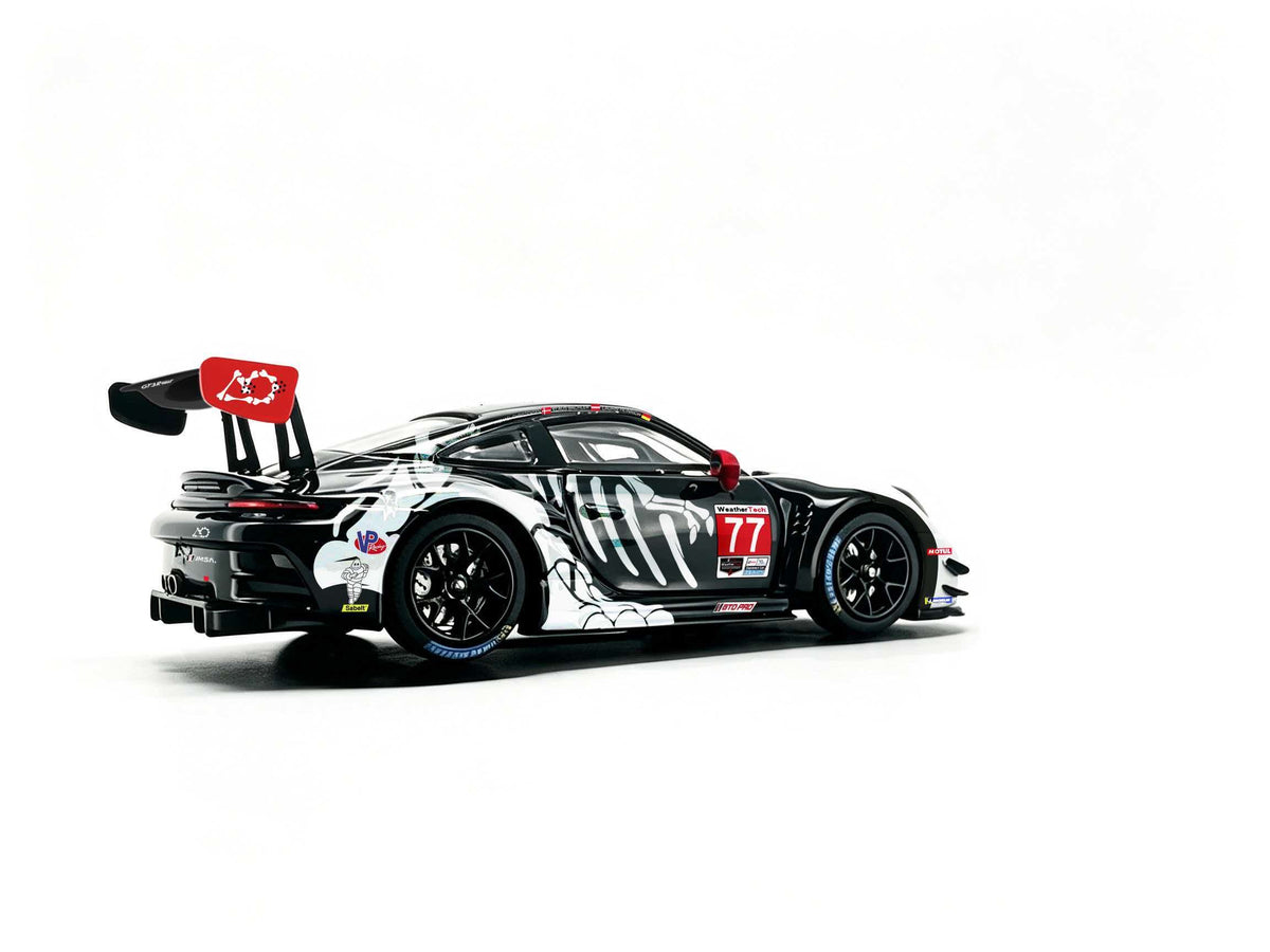 JICAR 1:64 Porsche 911 GT3 R #77 Tyrannosaurus Skeleton Livery White and Black Diecast Model Car Rear Side View Featuring Dinosaur Skeleton Graphics, Black Racing Wheels, Red Wing Endplate and Large Rear Wing.