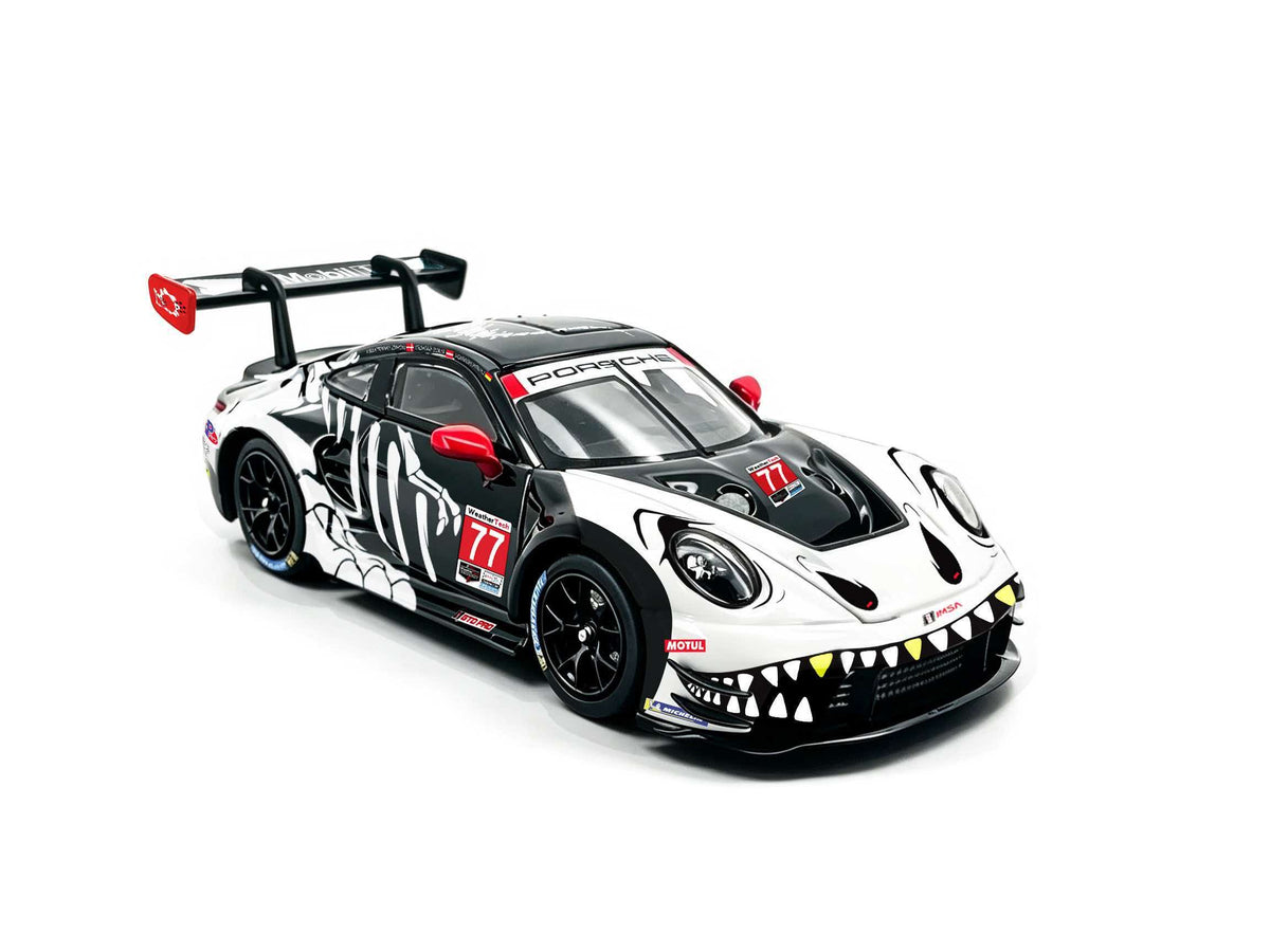 JICAR 1:64 Porsche 911 GT3 R #77 Tyrannosaurus Skeleton Livery White and Black Diecast Model Car Front Three Quarter View Featuring Dinosaur Skeleton Graphics, Red Side Mirrors, Black Racing Wheels and Large Rear Wing.