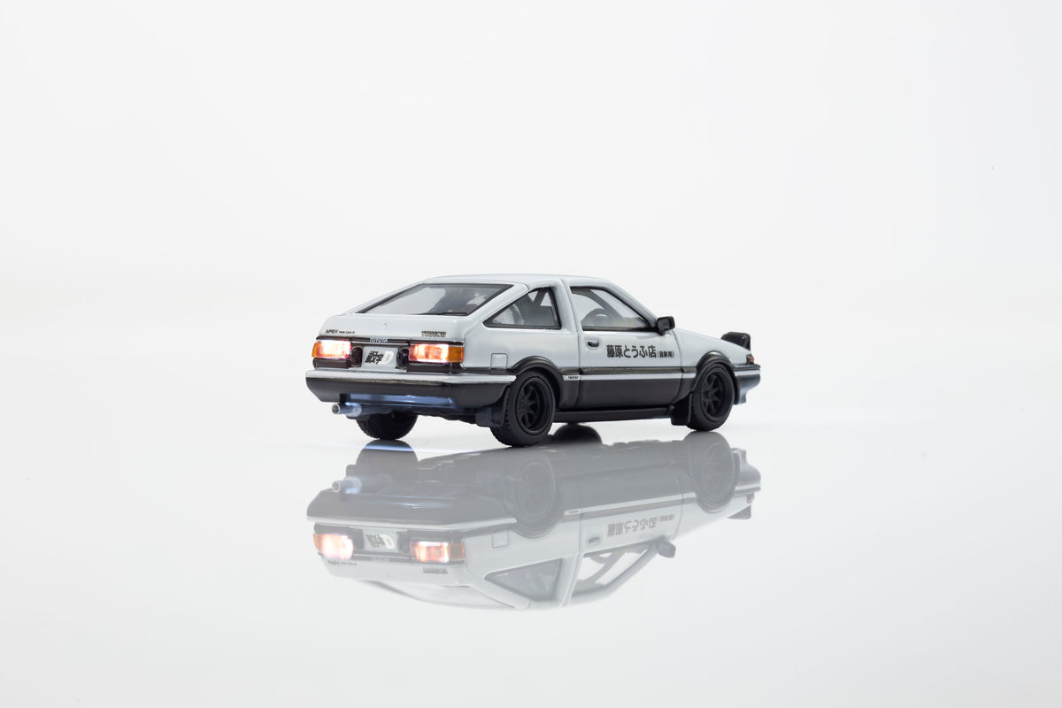KYOSHO 1:64 Toyota Sprinter Trueno AE86 Initial D Fujiwara Tofu Shop white and black diecast model car with illuminated taillights
