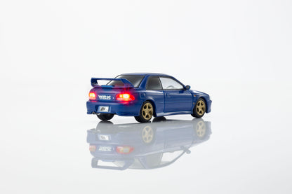 KYOSHO 1:64 Initial D Subaru Impreza WRX GC8 Bunta Fujiwara Blue diecast model car with gold wheels, rear wing and illuminated taillights