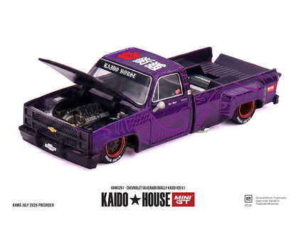 A miniature model of a purple Chevrolet Silverado with custom graphics and an open hood, displayed on a white background with 'KAIDO HOUSE MINI GT' branding at the bottom.