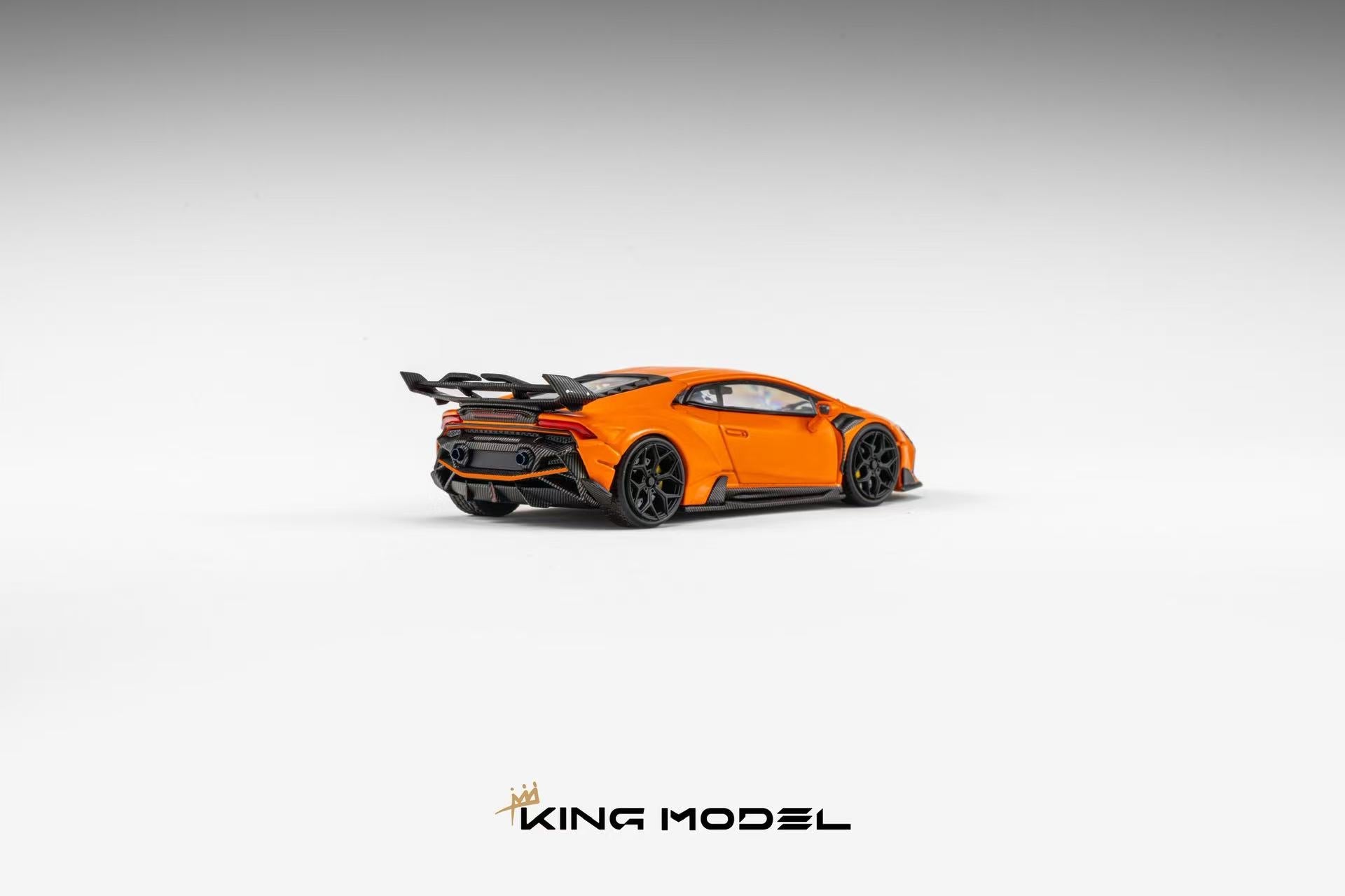 An orange and black scale model of a Lamborghini Huracan sports car, shown from a rear three-quarter angle on a light gray gradient background with the 'KING MODEL' logo at the bottom.
