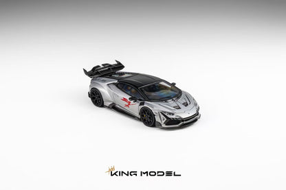 A silver and black scale model of a sports car with red graphic decals, shown from a three-quarters angle on a light gray gradient background with the KING MODEL logo at the bottom.