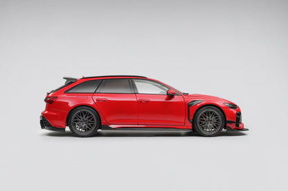 Red sports car with black rims on a gray background