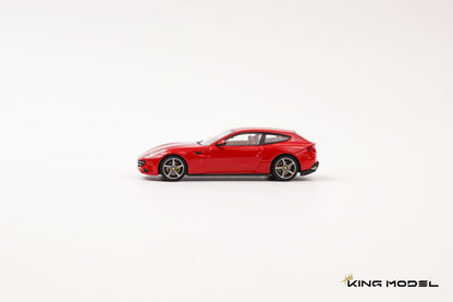 A red die-cast model sports car, resembling a Ferrari, shown in profile against a clean white background. The brand name 'KING MODEL' is visible in the bottom right corner.