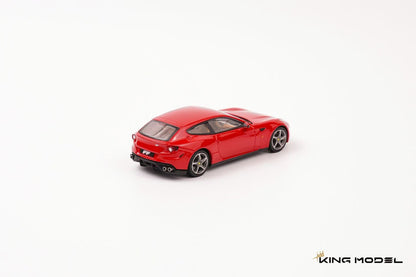 King Model 1:64 Ferrari FF in Rosso Corsa red featuring silver five-spoke wheels, yellow brake calipers, quad exhaust tips, and a tan leather interior. Premium diecast model displayed in a rear three-quarter view on a clean studio background, showcasing its distinctive shooting brake styling.