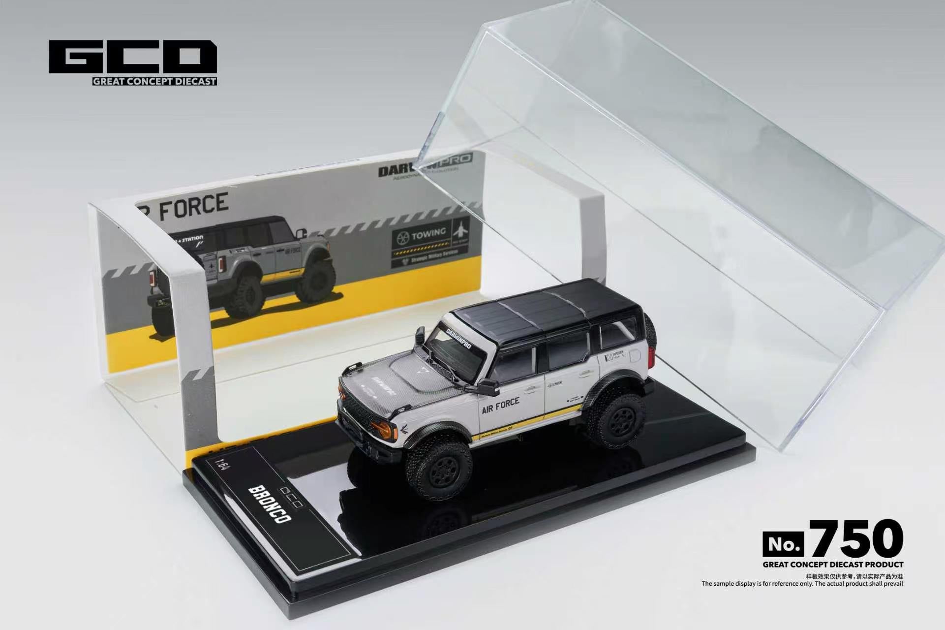 A miniature model car display set featuring a silver and black Dacia Breakaway model car on a black base, with its clear acrylic display case open and a branded backing card behind it. The GCD brand logo is visible in the top left, and a 'No.