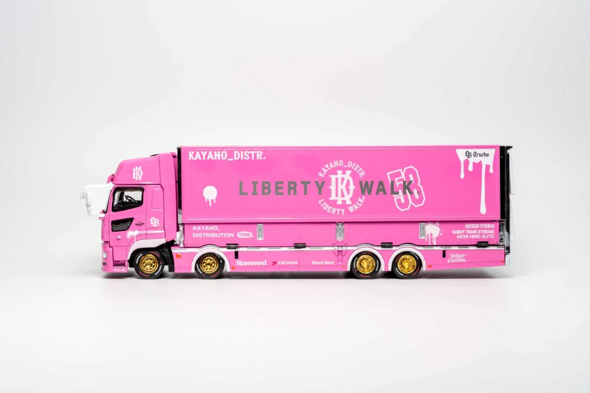 A pink diecast model of a semi-truck with a matching pink cargo box, featuring 'LIBERTY WALK 53' and 'KATANO_DISTR.' branding, set against a plain light gray background.