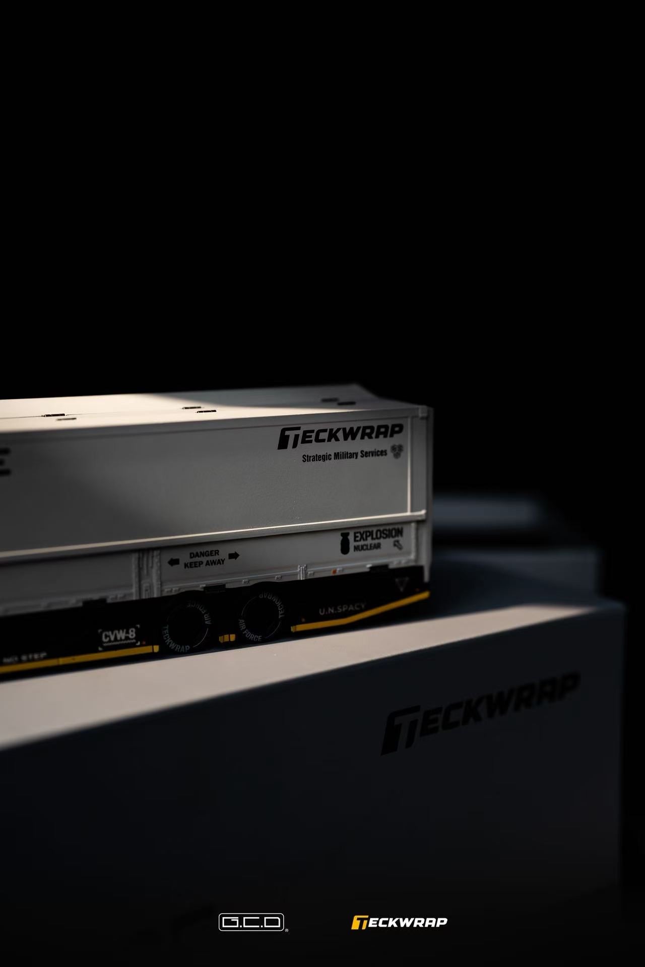 Hino Profia 700 DarwinPro &TECKWRAP Combat Grey Model train car with 'Teckwrap' branding on a dark background