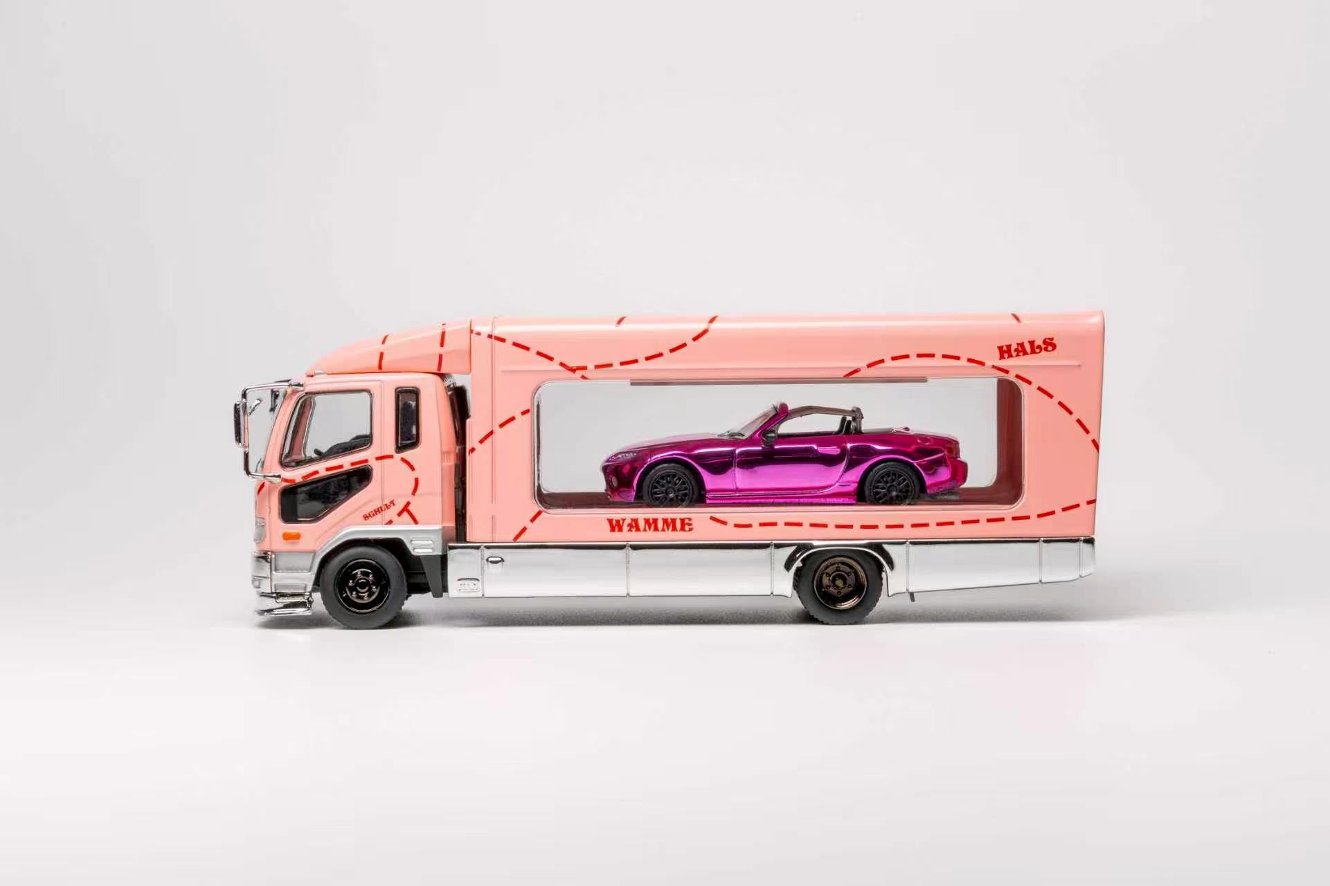 A pink toy truck carrying a purple convertible car in a clear side window, photographed on a clean light gray studio background.