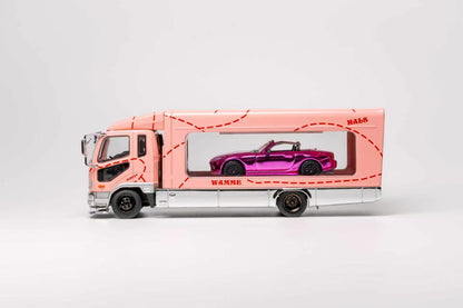 A pink toy truck carrying a purple convertible car in a clear side window, photographed on a clean light gray studio background.
