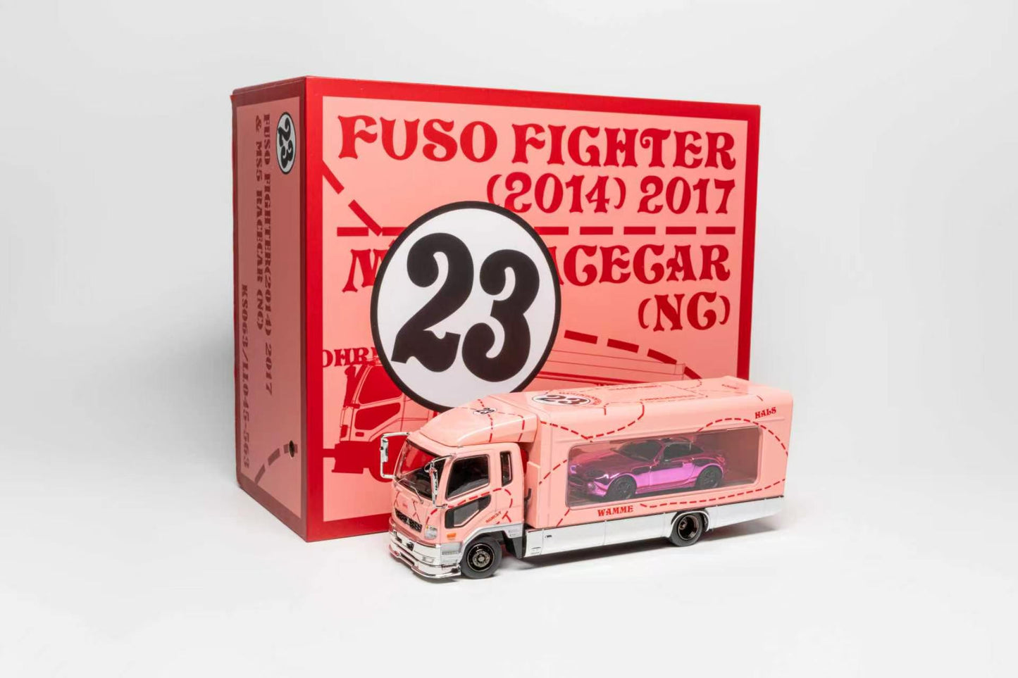A pink and white toy model truck labeled 'Fuso Fighter (2014) 2017' with a large '23' emblem, shown in front of its matching red and pink packaging box on a light gray background.