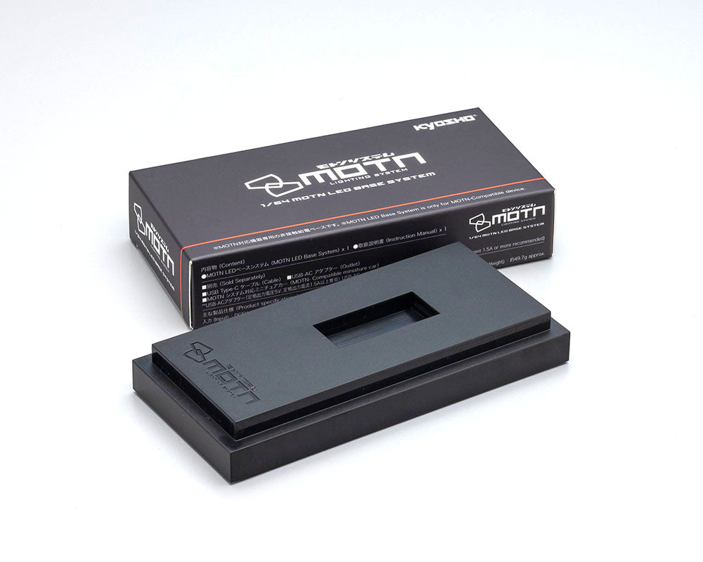 A black Kyosho 1:64 scale model LED base system, displayed alongside its packaging box.