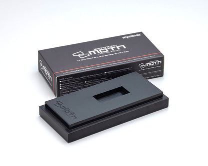 A black Kyosho 1:64 scale model LED base system, displayed alongside its packaging box.