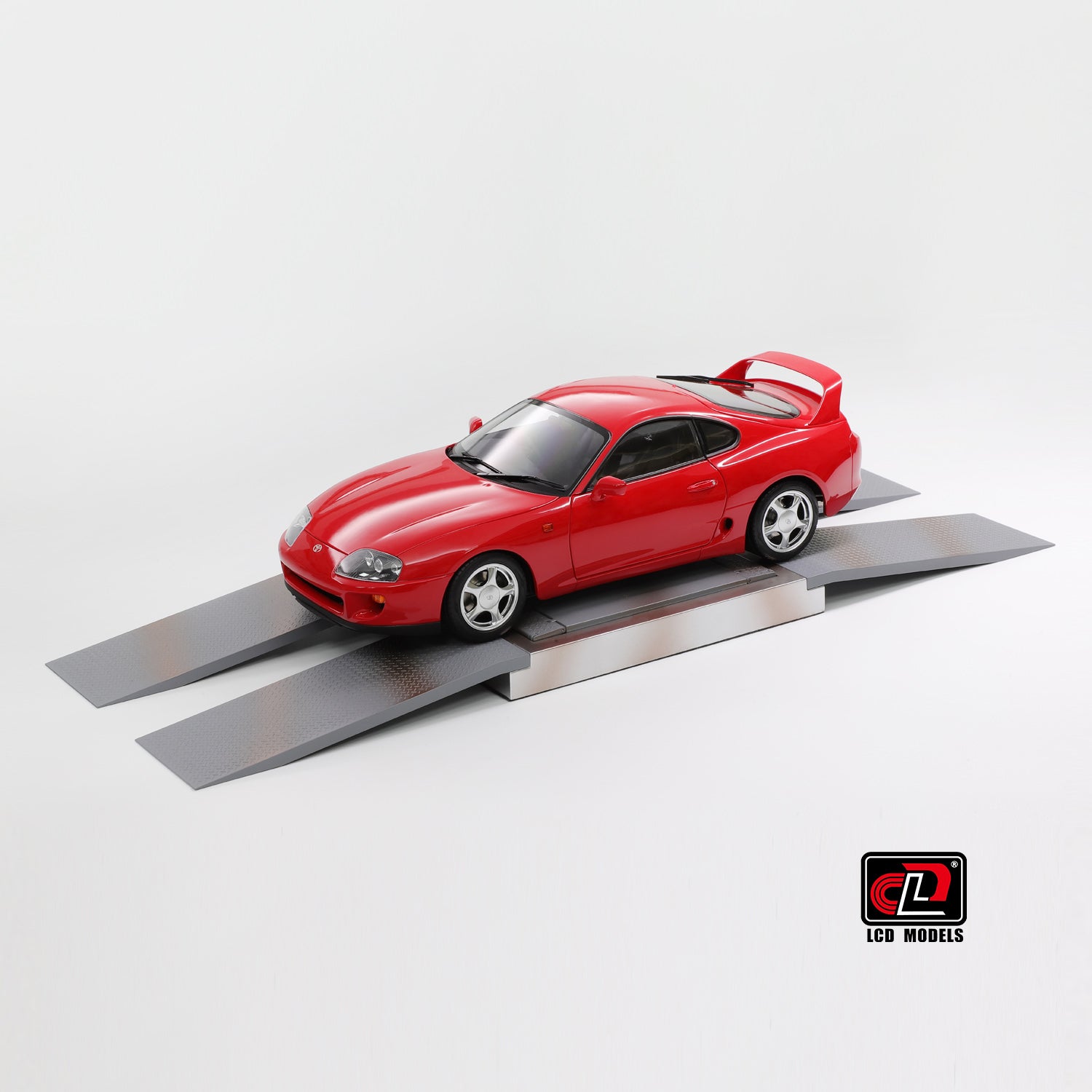 Red sports car on a scale with 'LED Models' logo in the corner