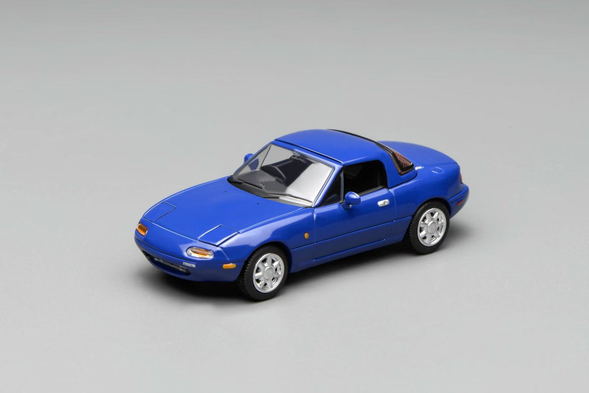 Blue model car on a gray background