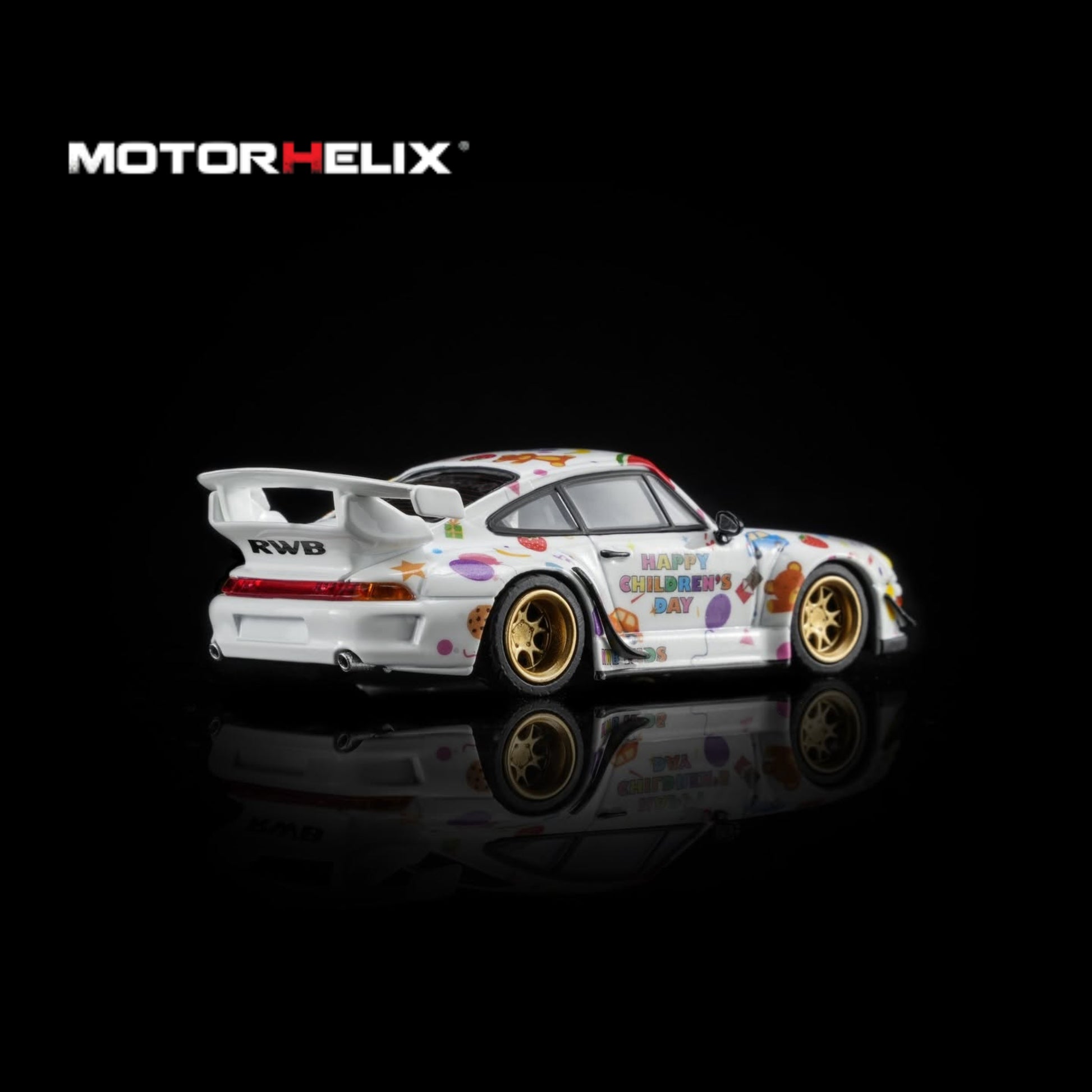 A white widebody sports car model with colorful graffiti-style decals, gold wheels, and a large rear wing, shown on a black reflective background. The MOTOR HELIX logo appears in the top left.