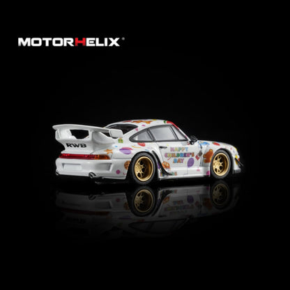 A white widebody sports car model with colorful graffiti-style decals, gold wheels, and a large rear wing, shown on a black reflective background. The MOTOR HELIX logo appears in the top left.