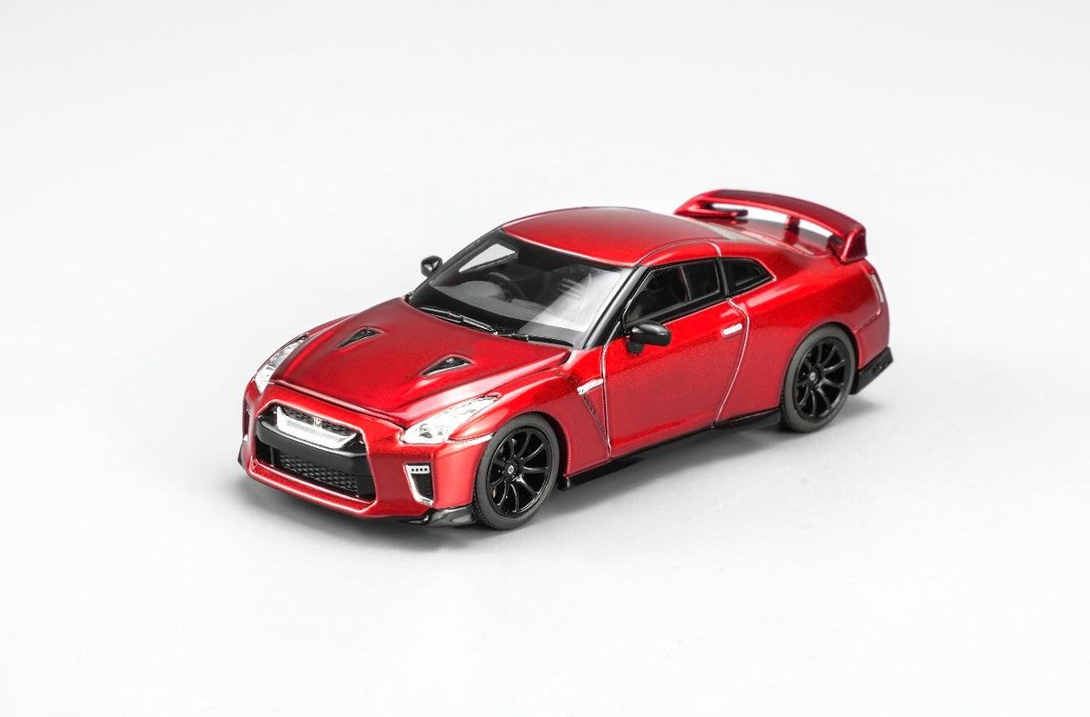 MotorHelix Nissan GT-R R35 1:64 diecast model in metallic red, Hong Kong Toycar Salon 2026 exclusive M63519DZ-PT, front three-quarter view with black wheels and rear spoiler.
