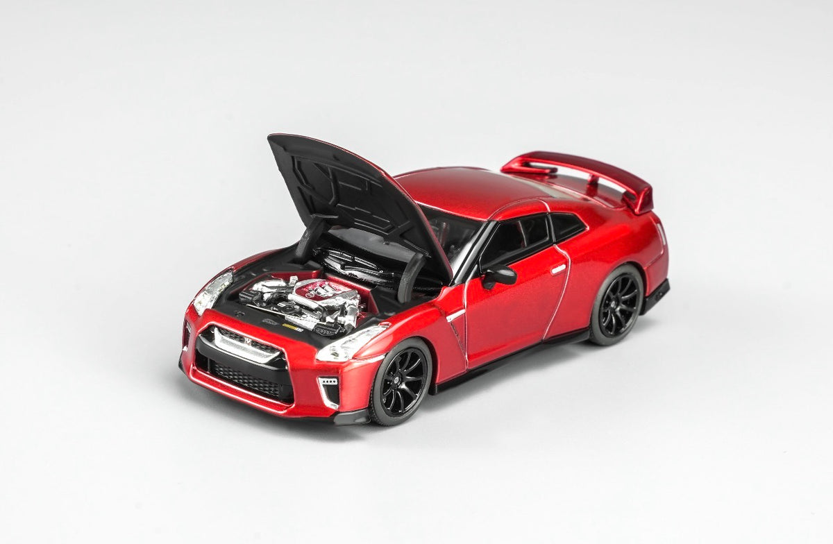 MotorHelix Nissan GT-R R35 1:64 diecast model in metallic red, Hong Kong Toycar Salon 2026 exclusive M63519DZ-PT, opening hood showing detailed engine bay, black wheels and rear spoiler.