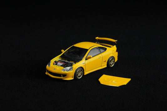 Yellow model car on a black background
