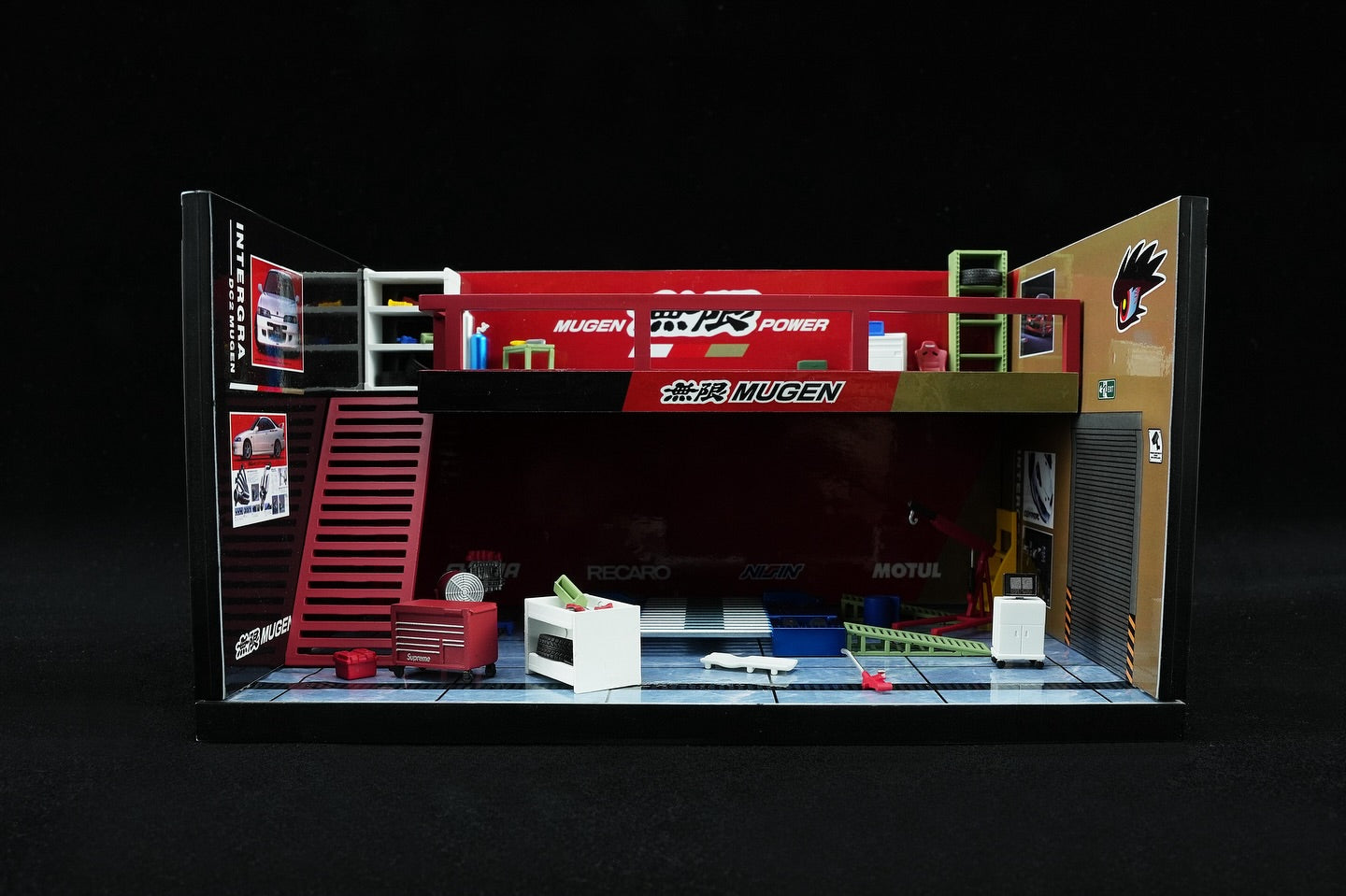 Model garage with various tools and equipment on a black background