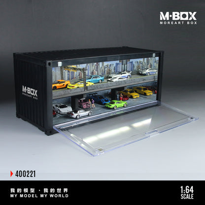 Model car display case with two levels of colorful sports cars set against a city skyline backdrop. Transparent front cover, labeled "M-BOX."