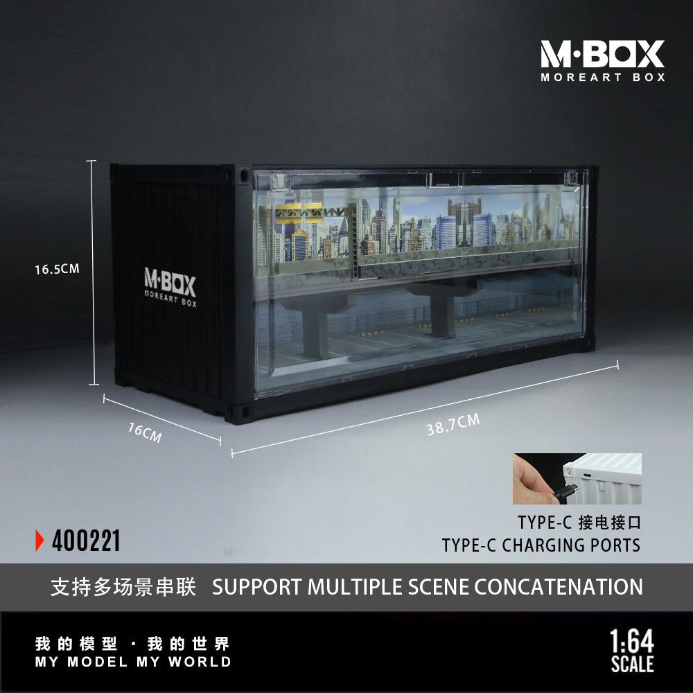 Model display case with urban skyline inside, labeled M-BOX MOREART BOX. Dimensions noted as 38.7cm x 16.5cm x 16cm, featuring Type-C charging, 1:64 scale.