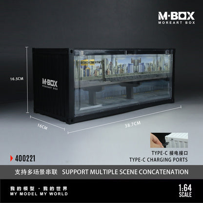 Model display case with urban skyline inside, labeled M-BOX MOREART BOX. Dimensions noted as 38.7cm x 16.5cm x 16cm, featuring Type-C charging, 1:64 scale.