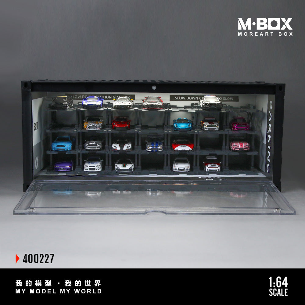 Model car display case with multiple miniature cars inside, featuring M-Box branding.