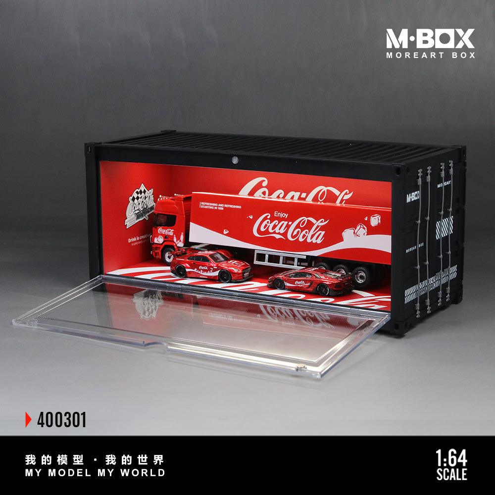 Model truck set in a Coca-Cola branded display case with M-Box branding.
