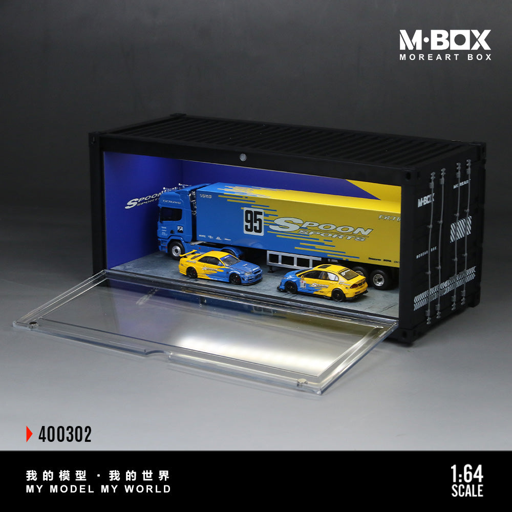 Model truck and cars in a display case with M-Box branding.
