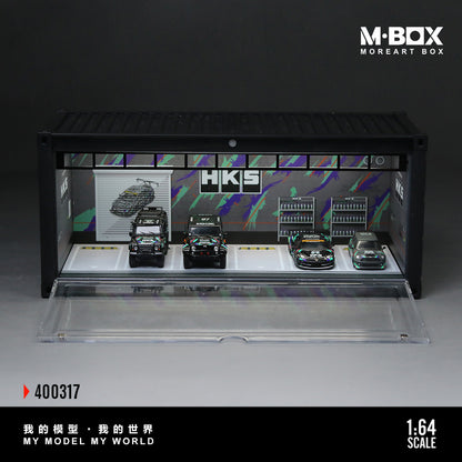 Model car display case with HKS branding and 'M-BOX' branding.