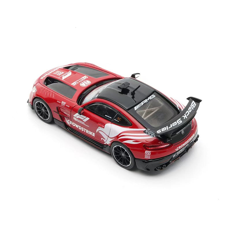 Red toy car with branding on a white background