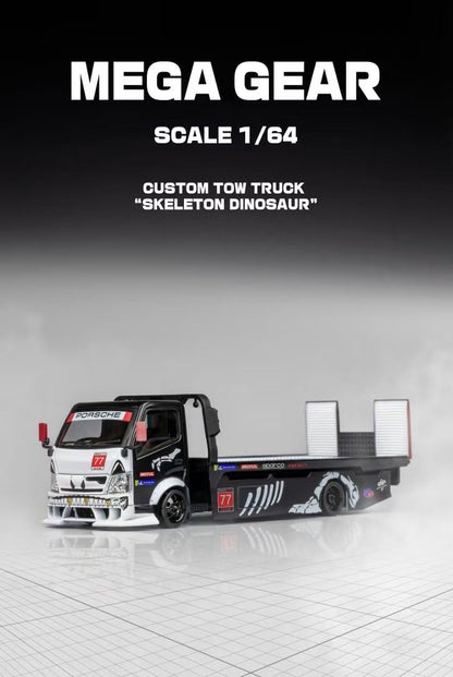 Model tow truck labeled "Skeleton Dinosaur" with black and white design, featuring skeletal graphics. Text above reads "MEGA GEAR, Scale 1/64."