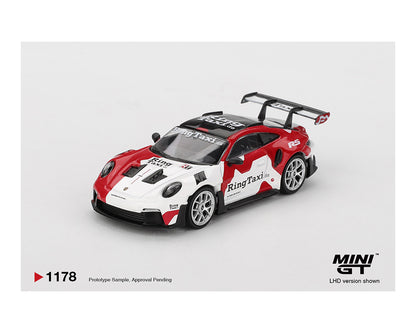 Model car with 'Ring Taxi' branding on a white background, featuring the Mini GT logo.