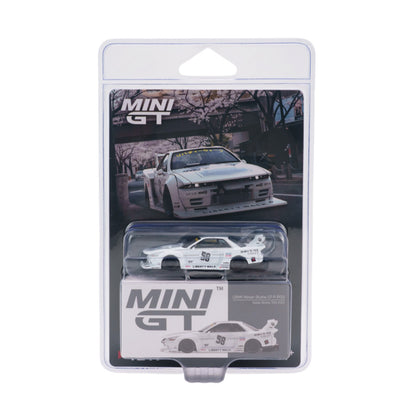 MINI GT brand die-cast model car in its original retail blister packaging, featuring a white Nissan Skyline R32 GT-S with racing decals.