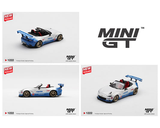 A model car, styled as a Mazda MX-5 Miata in white with blue accents and decals, gold rims, and a large blue rear spoiler. The images show various angles, showcasing the Mini GT branding. The car is detailed with sporty features, giving a dynamic and racing feel.