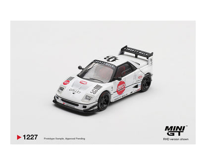 A detailed miniature white race car model with "Liberty Walk" branding, black accents, red decals, and a rear spoiler on a white background.