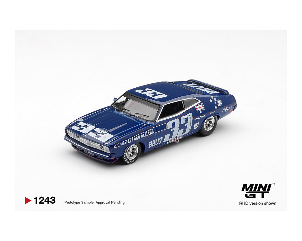 Blue model car with racing livery on a white background, featuring the Mini GT logo.