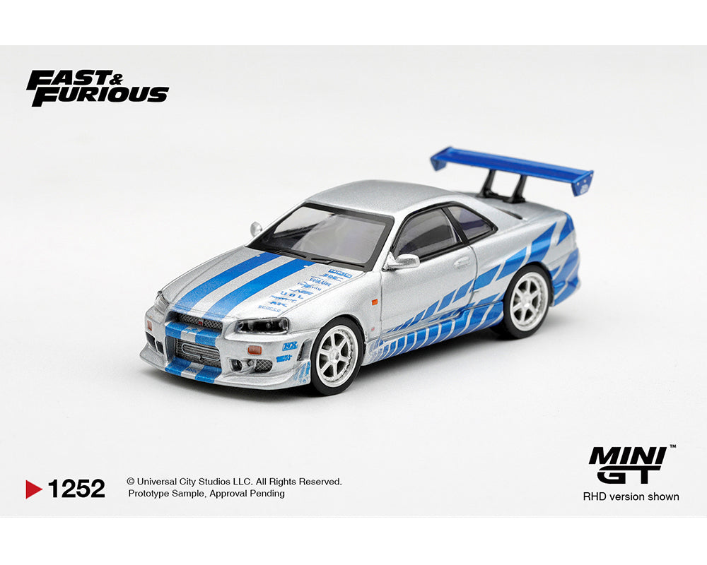 Mini GT 1:64 Fast & Furious Nissan Skyline GT-R R34 Silver MGT01252-BL diecast model car with blue racing graphics, white wheels and rear wing