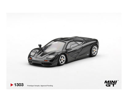 Black sports car model on a white background with 'MINI GT' branding.