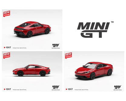 Red model car with 'MINI GT' branding on a white background